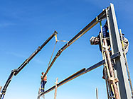 workers & crane truck erecting workshop steel portal