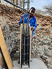 Sedney preparing steel for gabion room columns to support studio