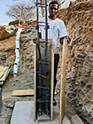Donald preparing steel for gabion room columns to support studio