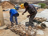 Donald & Sedney filling gabion basket with stones