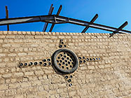 feature with glass bottles and tyre in workshop wall