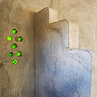 glass bottle feature in studio bathroom wall