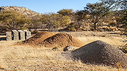 building material in river bed : stones, sand & bricks