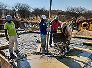 Licius workers pooring concrete for workshop slab