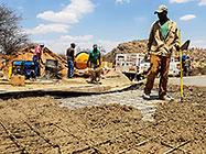 Licius workers pooring concrete for workshop slab