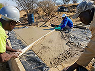 Licius workers pooring concrete for workshop slab