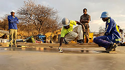 Licius workers pooring concrete for workshop slab