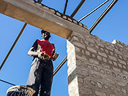 Licius workers bricklaying workshop walls