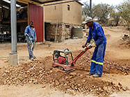 Donald & Sedney compacting area in fron of workshop