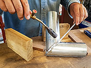 Paul soldering gutter elbow