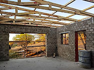 building roof wooden trusses on studio plastered walls