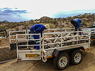 Donald & Sedney offloading bricks from trailer