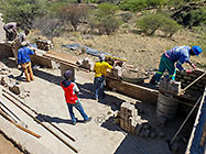 Bernard workers building house brick walls