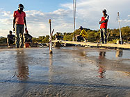 Bernard workers levelling house concrete floor
