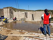 Bernard workers levelling house concrete floor