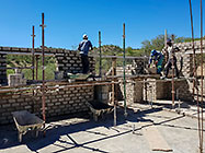 Bernard workers building house brick walls