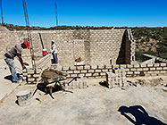 Bernard workers building house brick walls