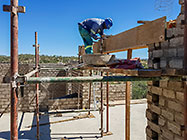 Bernard workers building house brick walls