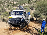 4x4 Unimog truck bringing house roof wooden beams