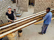 Lisa & Sedney sealing house roof wooden beams