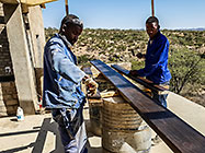 Rodney & Sedney sealing house roof wooden beams
