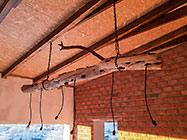 wooden log for light fitting over house dining room