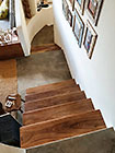 wooden stairs down to house lounge & office