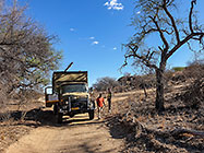 installing internet 12 m tower on top of hill with 4x4 truck & farm workers