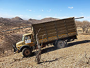 installing internet 12 m tower on top of hill with 4x4 truck & farm workers