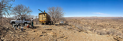 installing internet 12 m tower on top of hill with 4x4 truck & farm workers