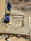 Donald & Sedney pooring concrete on house pool slab
