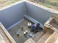 Donald & Sedney laying fiberglass mesh on house pool walls
