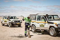 environmental field team taking borehole water sample