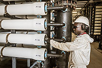 worker checking filter units in ultra filtration building