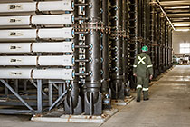 worker checking filter units in ultra filtration building