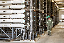 worker checking filter units in ultra filtration building