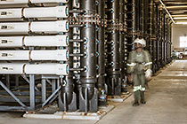 worker checking filter units in ultra filtration building