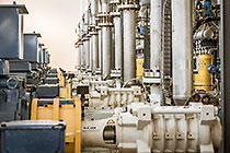 worker checking pump in reverse osmosis building
