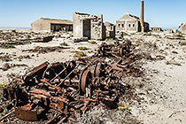 Ebay ghost town - rusted rail cart & old buildings