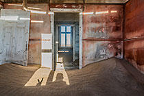 Bogenfels ghost town - photographer silhouette in old wooden house
