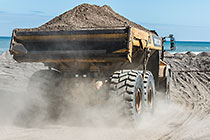 truck carrying sand for beach nourishment