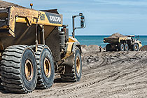 trucks carrying sand for beach nourishment