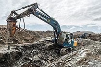 excavator breaking down diamondiferous seabed