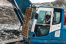 operator in excavator breaking down diamondiferous seabed