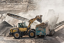 loader dumping diamondiferous gravel for separation