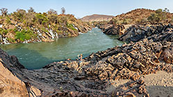 Lisa taking photograph of Kunene river waterfalls