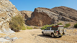 ranger driving in riverbed