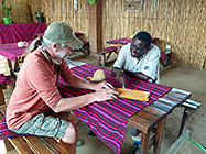 Elias explaining local dishes on menu to Paul