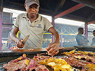 man preparing kapana at market
