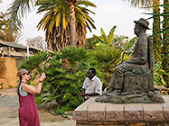 Elias & Lisa with bronze statue in garden statues in garden